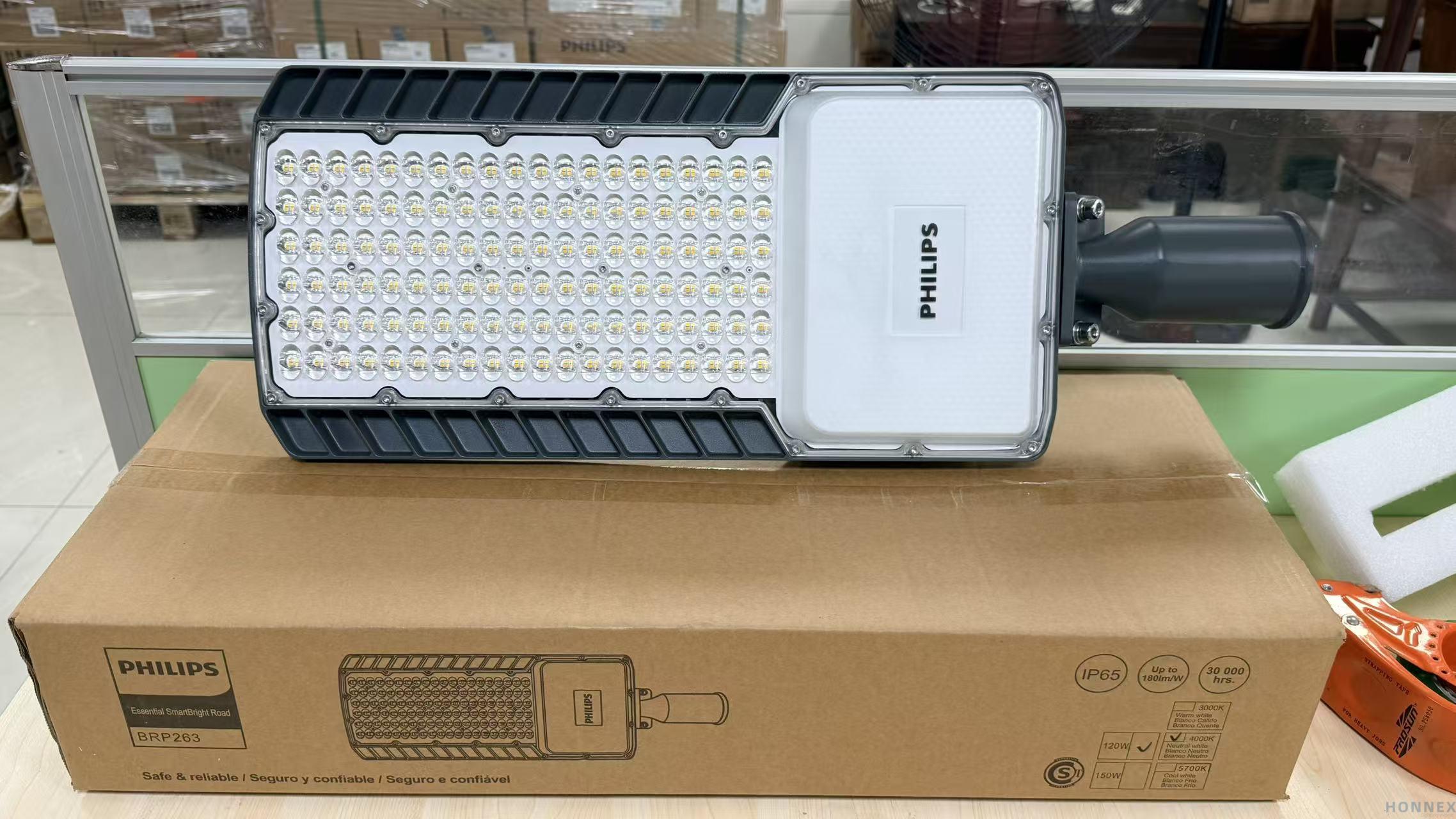PHILIPS BRP263 SmartBright LED Road Light 120W — real warehouse photo showing full LED array and side-entry mounting spigot