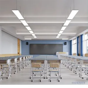 PHILIPS SP130S LED classroom lights suspended in a K-12 classroom with desks and blackboard